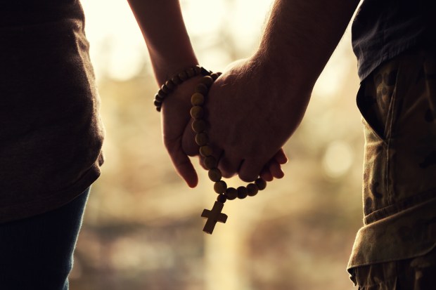 Couple Praying Rosary
