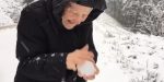 OLD WOMAN, PLAYING, SNOW