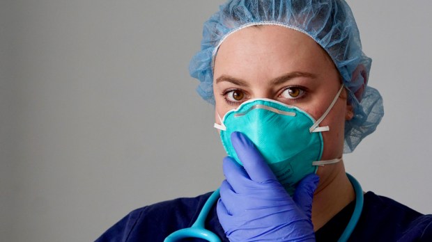 web3-close-up-of-a-female-nurse-putting-on-a-respirator-n95-mask-to-protect-from-airborne-respiratory-diseases-such-as-the-flu-coronavirus-ebola-tb-etc-shutterstock_1625323060.jpg