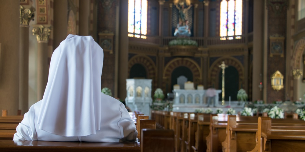 web3-nun-prayer-solitary-isolation-church-milkovasa-shutterstock.jpg