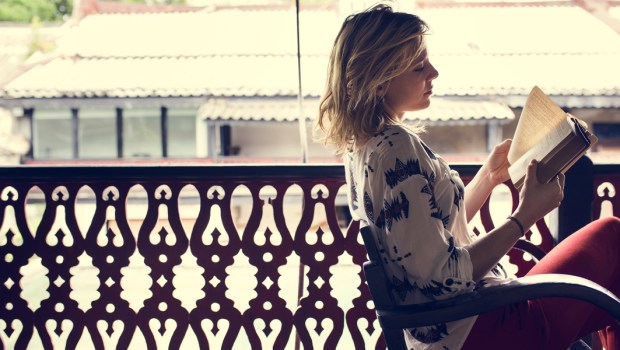 WOMAN READING,