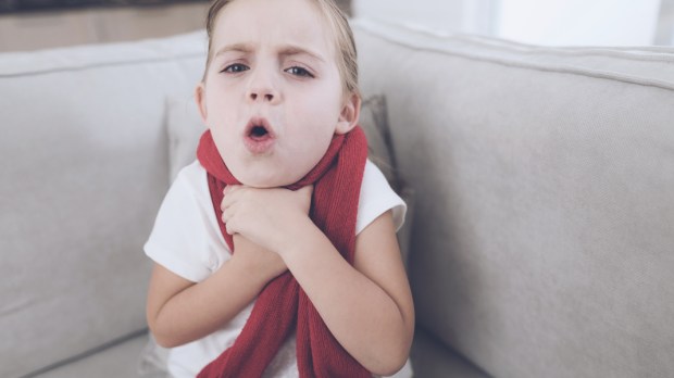 web3-little-sick-girl-sits-on-a-white-couch-wrapped-in-a-red-scarf-she-holds-her-hands-near-her-throat-the-girl-coughs-shutterstock_722670463.jpg