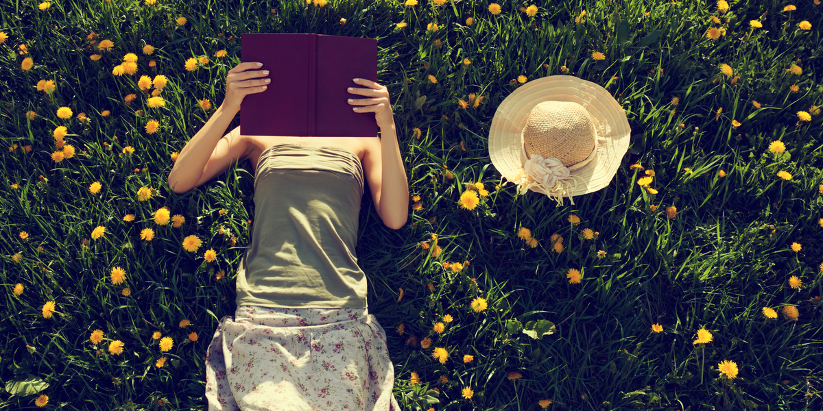WOMAN READS BOOK,