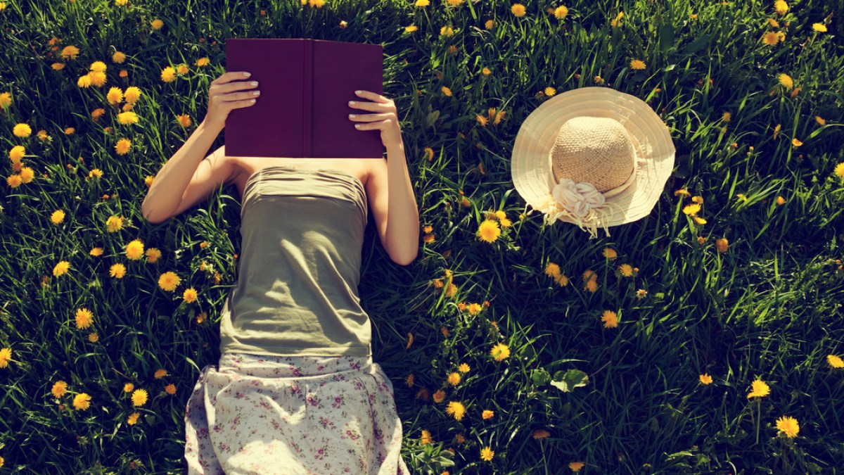 WOMAN READS BOOK,