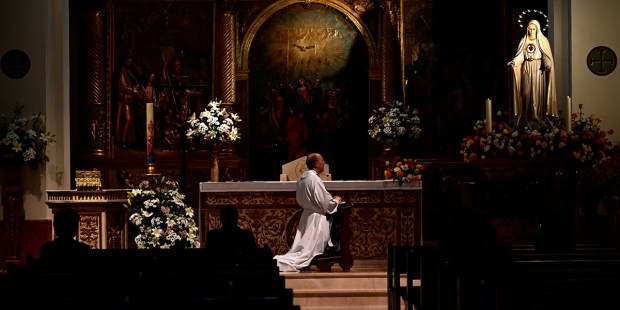 PRIEST PRAYING