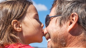 WEB3-Little-girl-kisses-her-dad-in-the-nose-Shutterstock_1028374978.jpg