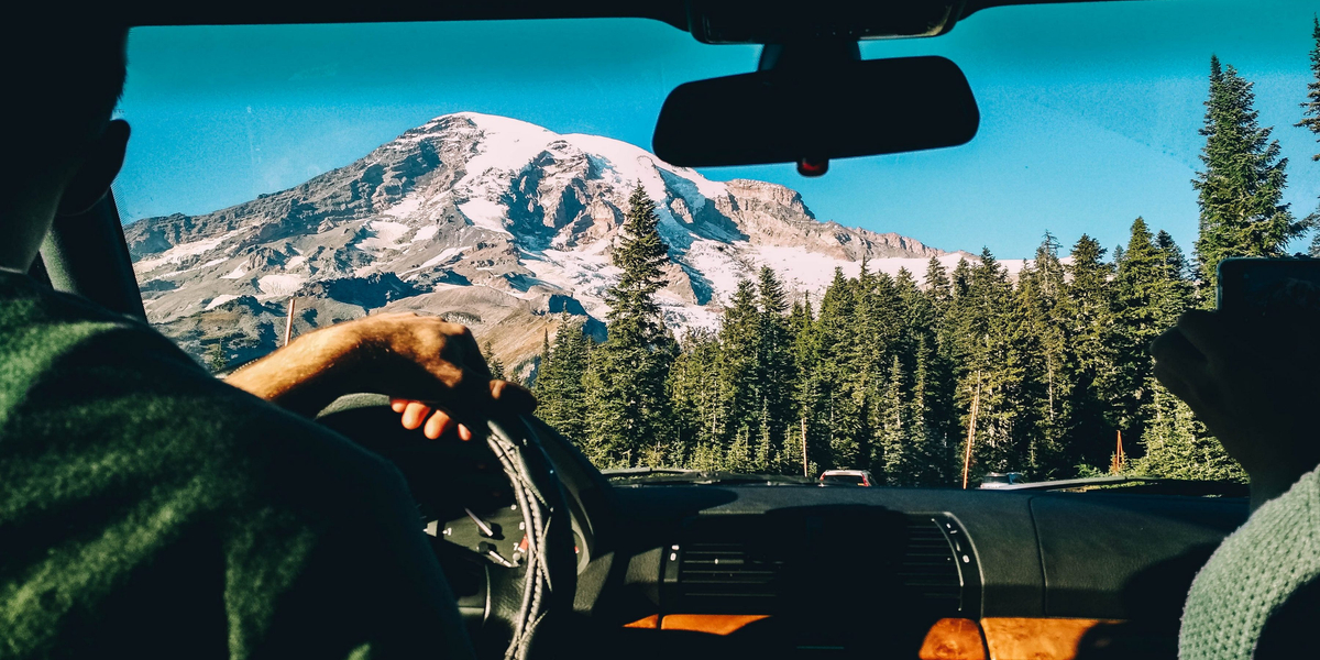 MAN, DRIVING, MOUNTAINS
