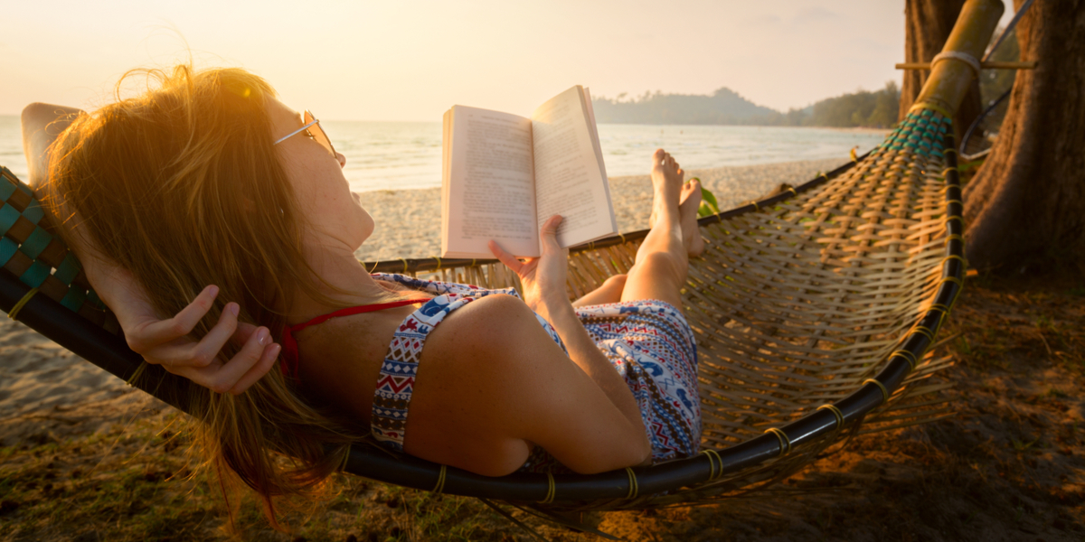 WOMAN, READING, SEA