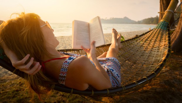 WOMAN, READING, SEA