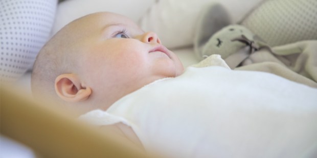 INFANT IN COT,