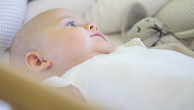 INFANT IN COT,
