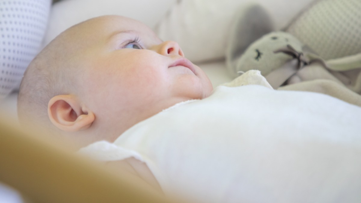 INFANT IN COT,