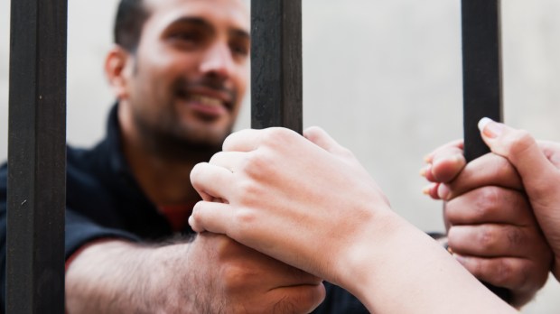 PRISON, MAN, WIFE HANDS