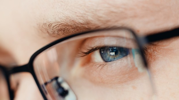 WEB3-Close-up-of-glasses-and-blue-eye-of-man-Concept-businessman-student-read-reflect-think-Shutterstock_1027636945.jpg