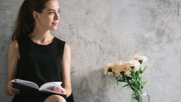 WOMAN, BOOK, FLOWERS