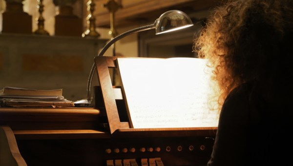 WOMAN PLAYING THE ORGAN,