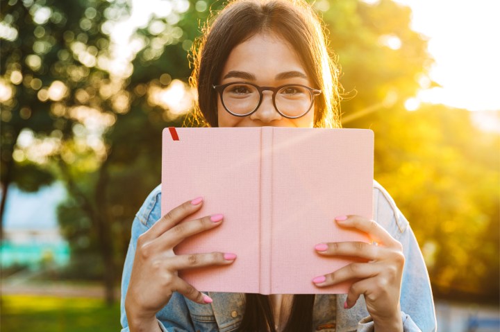 YOUNG WOMAN WITH EYEGLASSES,