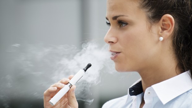 WOMAN SMOKES,