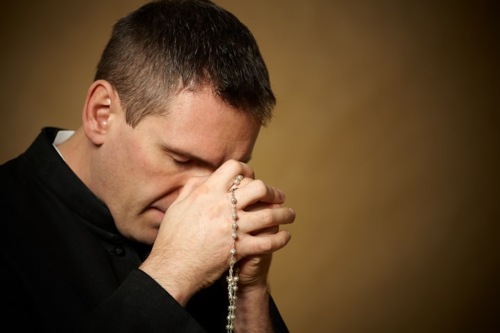 PRAYING PRIEST