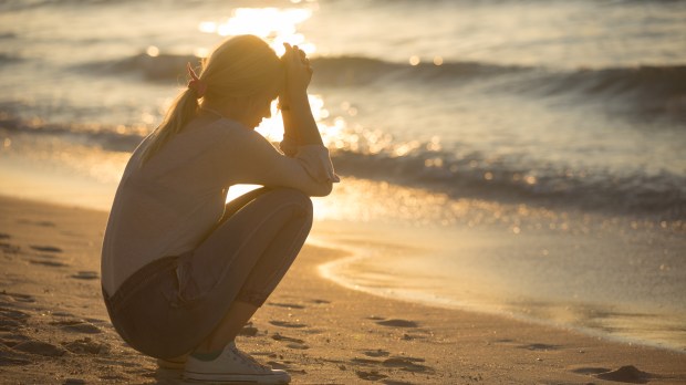 SAD WOMAN, BEACH