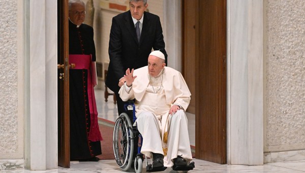 Pope Francis arrives on wheelchair