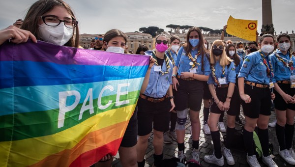 boy scouts hold peace flag in hand during Pope Francis Angelus.