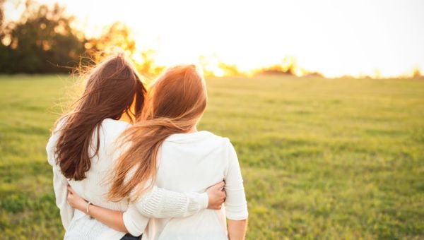 Young women in white sweaters