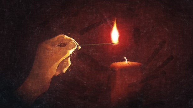 single candle, fire, hand