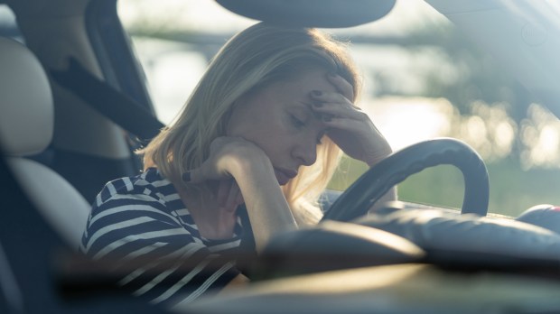 Depressed middle woman driver sitting inside car feeling doubtful confused about difficult decision suffering from personal psychological problem