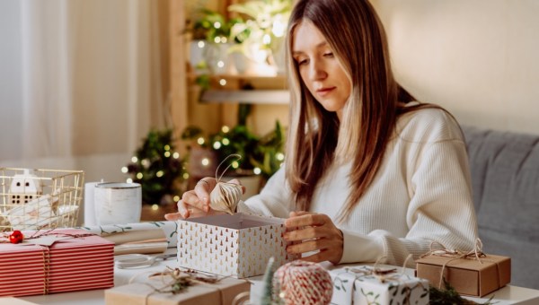 woman wraping gifts