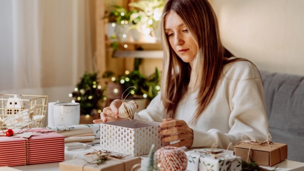 woman wraping gifts