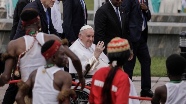 Pope-Francis-seated-on-a-wheelchair-waves-as-he-arrives-at-the-Ndjili-International-Airport-in-Kinshasa-AFP